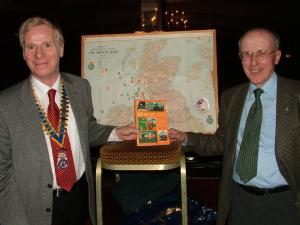 Jim Begg shows President Bruce is book Rescue 177