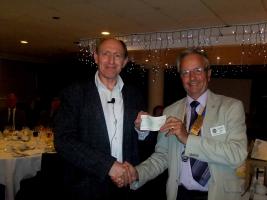 President Martin Odell presents a donation to John McLaughlin 