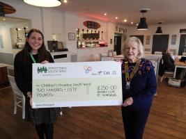 Mary Gray receiving a cheque from President Angela at the Beech Hotel, Minehead.
