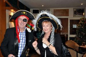 President David and his wife Clare in pirate costume aiming to capture the mood of the evening