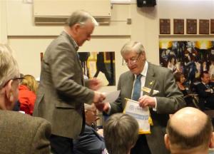 President David Milner receives banner from IPDG Rod Walmsley