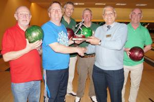 The team being presented with the District Trophy by Assistant Governor Miles leadbeater.