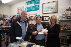 Clive Richardson and Doug Simmons hand over the two cheques