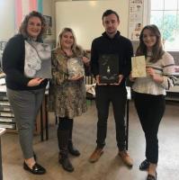 Hawick High staff (from left Mrs Scott, Miss Anderson, Mr Henderson and Miss Ling) hold the artwork awarded first or second prize in each age group category
