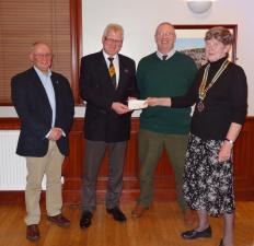 President Mairhi presents cheque for £3800 to Hawick Flood Protection Group members Stuart Marshall and Andy Lewis