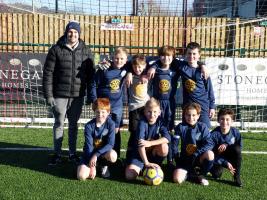 Send CofE School proudly showing their new Football Kit