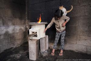A girl using one of the stoves