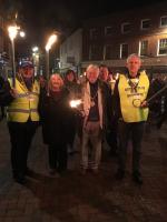 Godalming Mayor Nick Williams leads the torchlight processing with his wife Jeanne, Woolsack President Mike Slocombe (L) and Godalming Rotary President Clive Graham (R).
