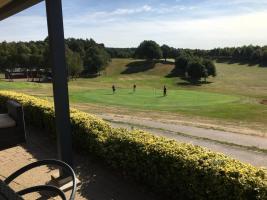 View over the 9th green back down the fairway