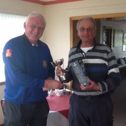 Colin presenting Peter with the Pete Rickard Trophy and a bottle of Jura