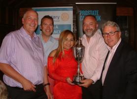 Rotarian Gary Zabel (far right) presenting the trophy to Three Men and a Lady, winners of Leatherhead Rotary Club’s 27th Annual Charity Golf Day held at Effingham Golf Club on Friday 24th August 2018