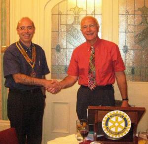 2009-10 President Farouk Kardahji accepts the President's Jewel from outgoing 2008-09 President Ian Saunders.