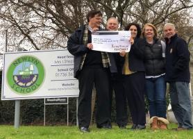 President Laurie Forde hands over £1,500 at St Julia's Hospice, Hayle.