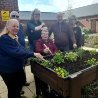 Rotarians Pam Watson -Jones and Rosemary Sudlow present the first planter.