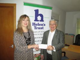 Photo: President Phil Pegg presents a cheque to Zoe Woodward, the Fundraising and Business Manager of Helen’s Trust