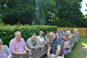 A few of the attendees who moved outside after the meal