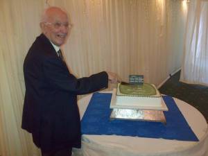 Alan cutting the cake