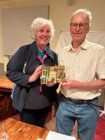 Christ Shortt presenting Mary Zoeller with the Rotary Club of Epsom Plaque