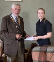 Zoe receives her gift from President Ron