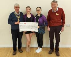 President Clive Livingstone with Jim Anderson presenting the grant to the two members of the England Dance team