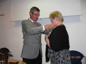 New President Margaret Clark receives her Chain of office from David Hill