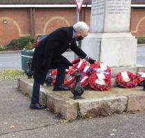 President Mike Haythorpe lays  wreath on behalf of the Rotary Club.