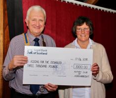 Sue Cooper receives cheque from Club President Paul Tebay