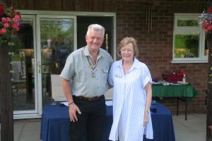 Roger Simmons being presented with his regalia.