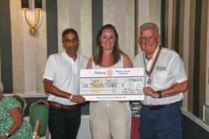 Niki and Deenu Patel receiving our cheque from Roger Simmons our Past President