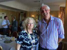 The picture shown Andrew with President Diana Loveland .