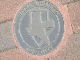 One of the 34 bronze pavement markers