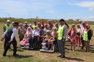 Town Crier Peter White cutting the ribbon at the start of the RAINBOW Walk
