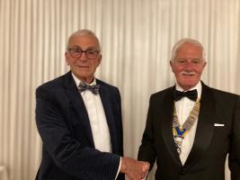 Past President Carey Glyde handing over to the incoming President Stuart Telling