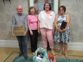 Debbie Golden and Lawrence from Emmaus with President Suzanne Taylor-Warren and President Elect Janet Dagys.  The Club donated toiletries to Emmaus.