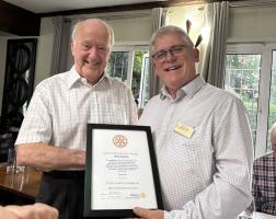 Rotarian Ken Collins receiving his award from Rotary President-Elect John Ollerton