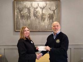 Senior Vice-President, Mark Duncan, hands over the cheque to Allison Higgins, the RBL representative.