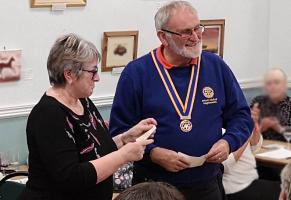 President Colin presenting a cheque for £310 to Lou Bagnall curator of Teignmouth Heritage Museum