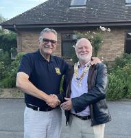 Handover from President Stav  Melides to our new President Ted Hands at our annual social BBQ at Rand