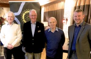 President John Kilby (centre left) welcomes Craig Mair (centre right) as a member of Rotary.  Also present are visitors to the Club: Henry Twohig (left) and Malcolm Cheyne