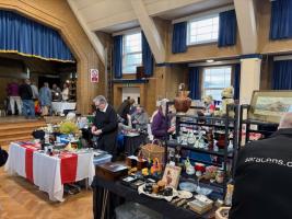 Stall holders and customers view the items on offer