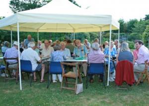Members and friends enjoying the barbecue on a glorious evening in beautiful surroundings.