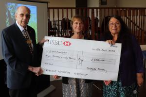 Tony Henley, Chair of International Committee and Vice President Mandy Davis presenting Michele Spencer (centre) with the donation cheque to CTAS
