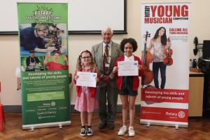 Clive Livingstone, 2nd Vice President of Seaford Rotary after presenting the winner, Venus and runner up, Elwen, in the Junior category with their certificates and prizes
