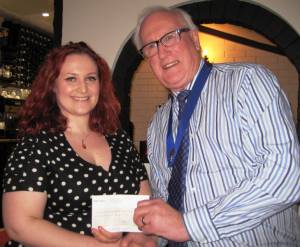 IPP Alec Banyard presents Mica Day with cheque