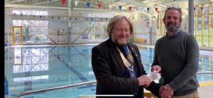 President AdrianScadding presents a cheque to Nick Chandler of Bridport Leisure Centre