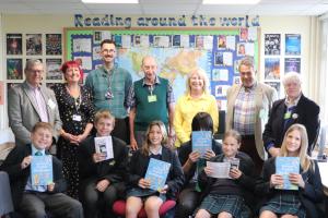 Back row:  Paul Vaesen, teachers Charlotte Davis and Robert Dale, Geoff Lowles, volunteer Sarah Laidlaw, David Pattenden and volunteer Ann Etheridge.  Front row:  Pupils with their dictionaries and calculators