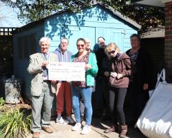 Barbara Billington, Deputy Manager, Bradbury Centre with some of the service users being presented with the grant cheque by President Clive Livingstone 