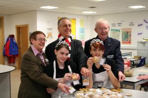 Students at Salford City Academy packing Eccles Cakes with President Rosemary, Harry Pickles and Eddie Sheehy