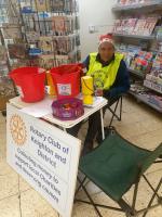 Past President Ivan manning the table with Christmas hat!