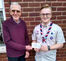 Community Service Chair. Alan Conchie presenting Daniel Barton with our donation.
